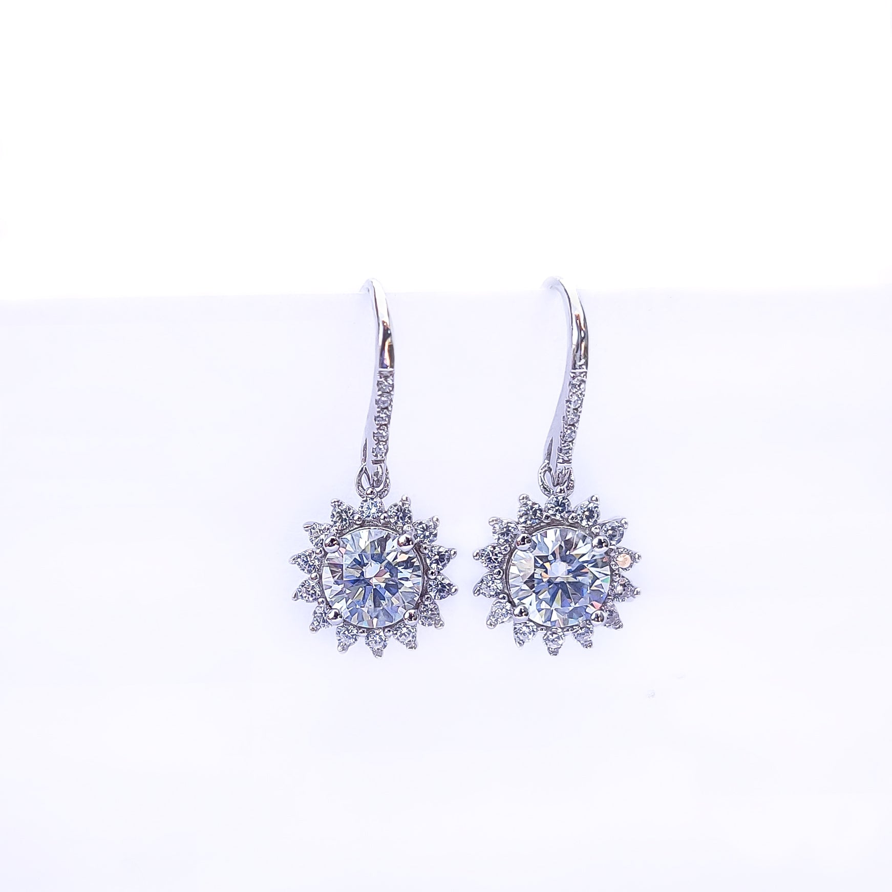 Beautifully crafted in Sterling Silver and plated in 18k Gold, the earrings feature each 1 carat Moissanite stones. 