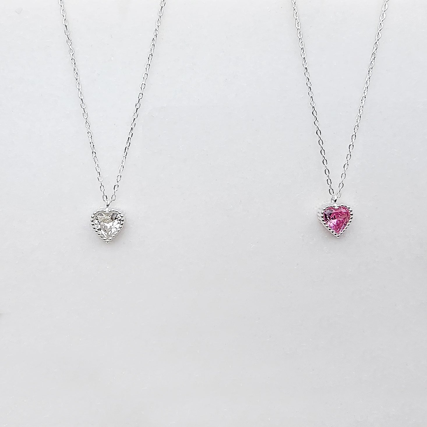Hot Pink, shimmering White or both? This Brilliant Heart necklace crafted in Sterling Silver and embellished with pink or white heart shaped zirconia stones makes a great statement for any outfit. It's gorgeous and can be worn on daily basis or for special occasions.  Metal: 925 Sterling Silver  Chain Length:16 Inches + 2 inches extension Nickel & Lead free & Hypoallergenic