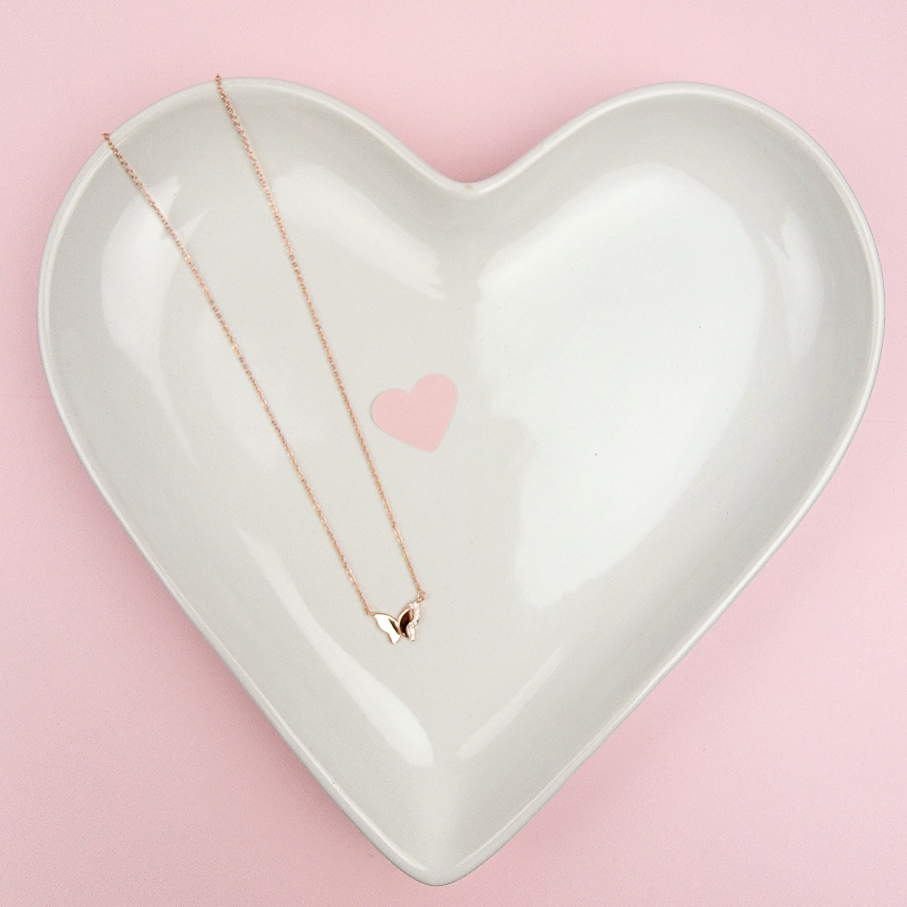  As the universal symbol of transformation and evolution, the butterfly also represents femininity and sensuality. Delicate, elegant and charming, the Sparkle Wing Butterfly Necklace features a butterfly pendant crafted in Sterling Silver, plated in Rose Gold and decorated with cubic zirconia stones.   Metal: 925 Sterling Silver with 18K Rose Gold plating Chain Length:16 Inches Nickel & Lead free & Hypoallergenic Complimentary Gift Box Included