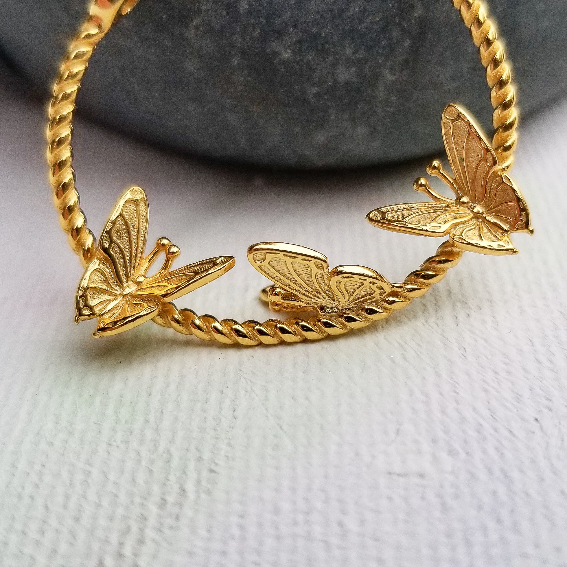 Who does not like butterflies? One of nature's most beautiful creatures is captured perfectly via this delicate pair of butterfly earrings. Crafted beautifully in a flying position, in 14K Gold Plated 925 Sterling Silver, the Flying Butterflies Earrings dangle below the earlobes for a subtle and beautiful look.  Material: 14K Gold Plated 925 Sterling Silver Shape: Butterflies on a hoop style Nickel & Lead free & Hypoallergenic Earrings are held in place by Sterling Silver earring backs.