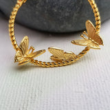 Who does not like butterflies? One of nature's most beautiful creatures is captured perfectly via this delicate pair of butterfly earrings. Crafted beautifully in a flying position, in 14K Gold Plated 925 Sterling Silver, the Flying Butterflies Earrings dangle below the earlobes for a subtle and beautiful look.  Material: 14K Gold Plated 925 Sterling Silver Shape: Butterflies on a hoop style Nickel & Lead free & Hypoallergenic Earrings are held in place by Sterling Silver earring backs.